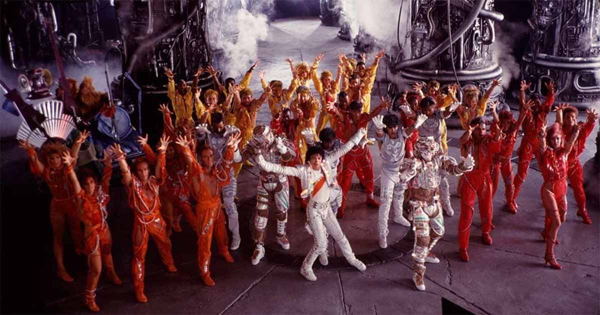 Michael Jackson can be seen in the center of the dance scene.