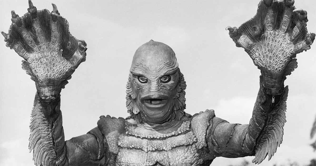 A promotional image showing the creature with its hands raised.