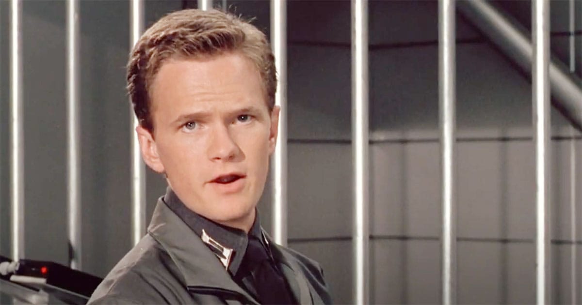 Carl Jenkins addressing the public during a broadcast in "Starship Troopers."