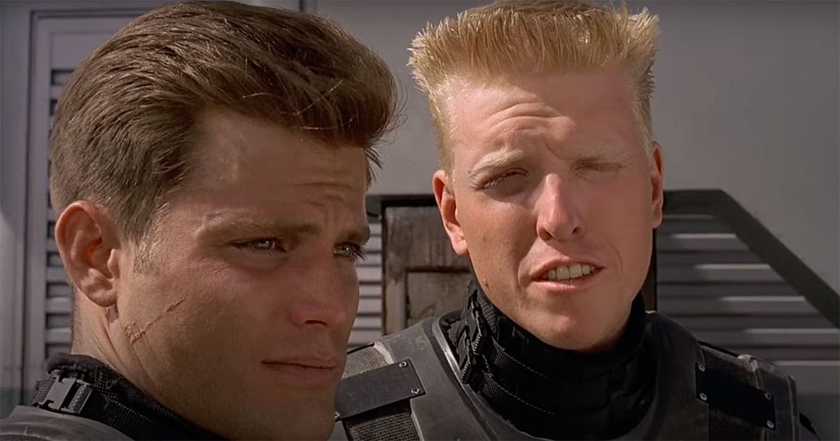 Johnny Rico and Sergeant Zim wearing Mobile Infantry armor in "Starship Troopers."