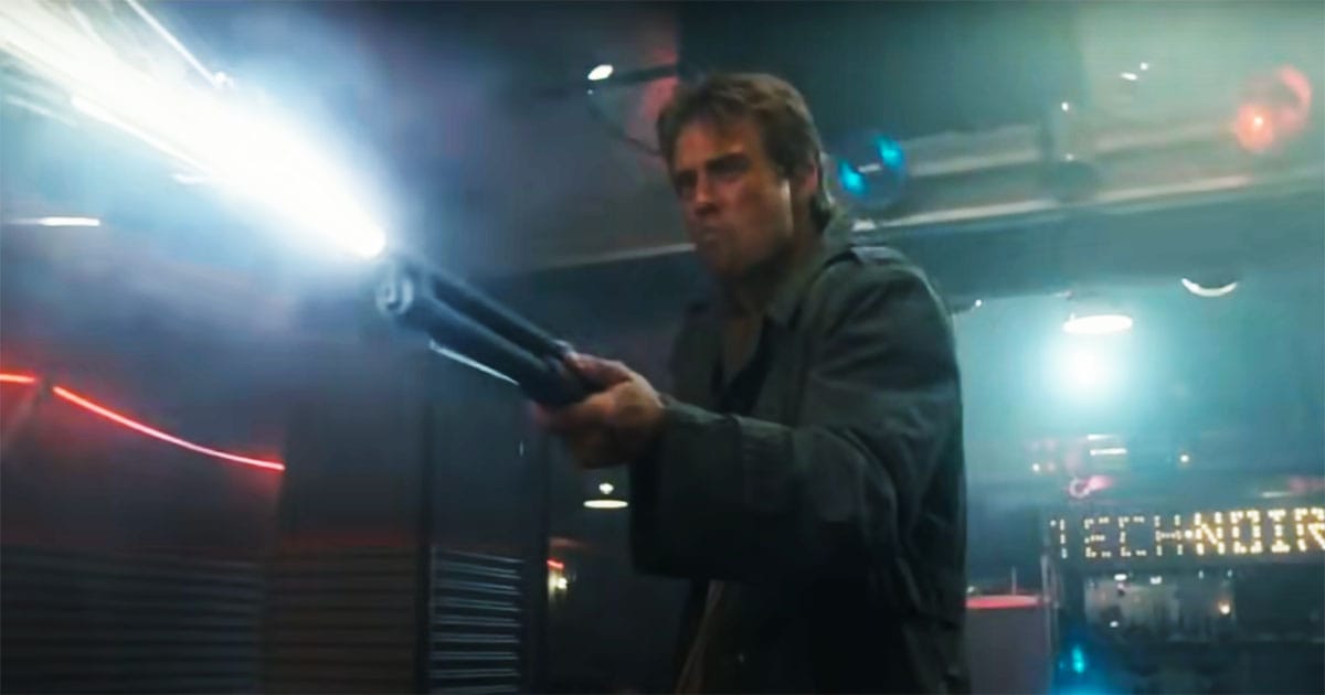 "Kyle Reese shooting a shotgun inside the neon-lit Techn Noir nightclub, defending Sarah Connor from the Terminator."
