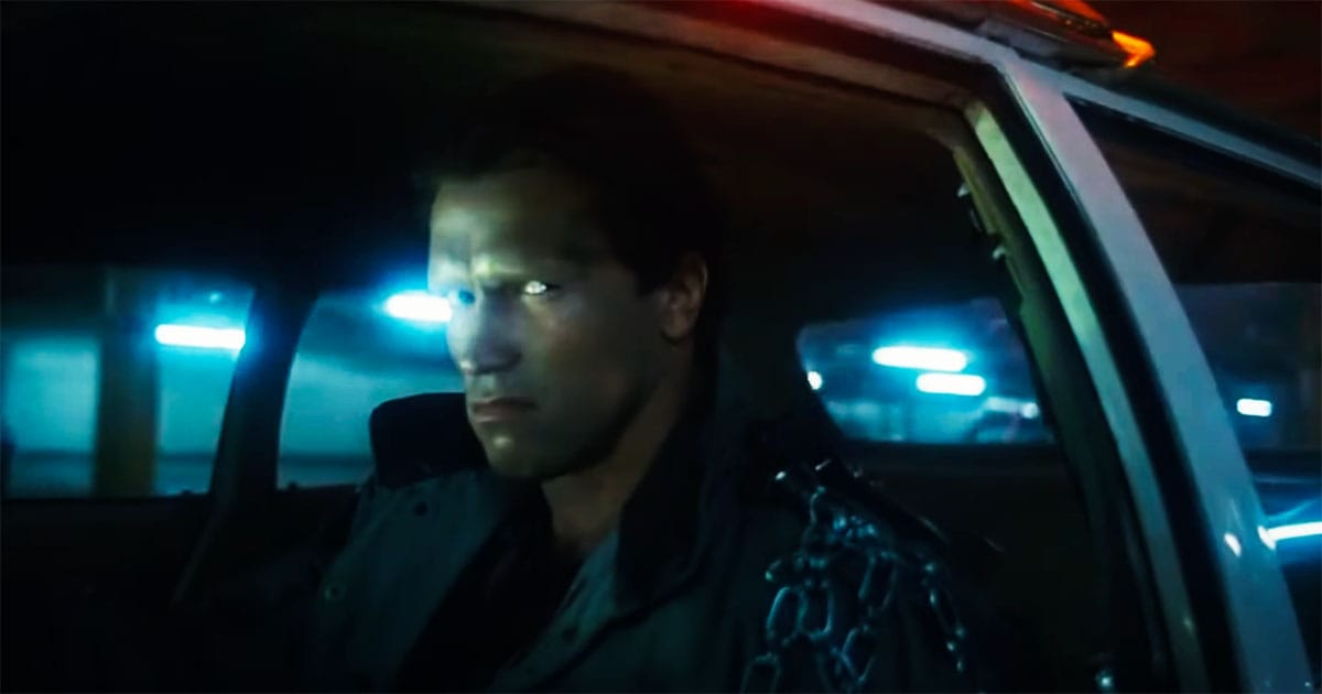 "The Terminator sitting in a car, illuminated by neon lights, staring ahead with a cold, mechanical focus."