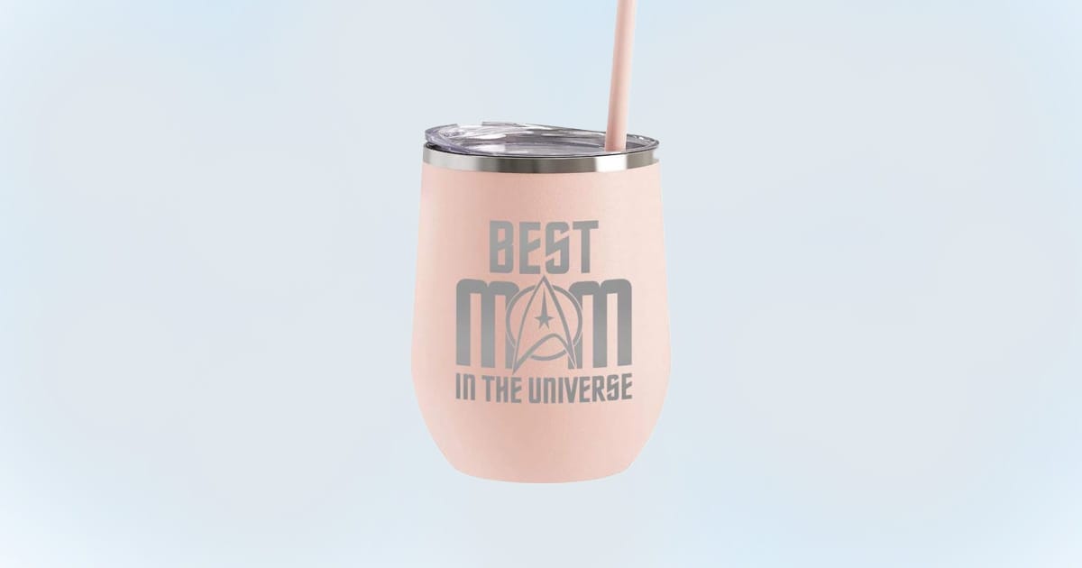 Light pink stemless travel tumbler with lid and straw, featuring the phrase “Best Mom in the Universe” in a Star Trek-inspired font.