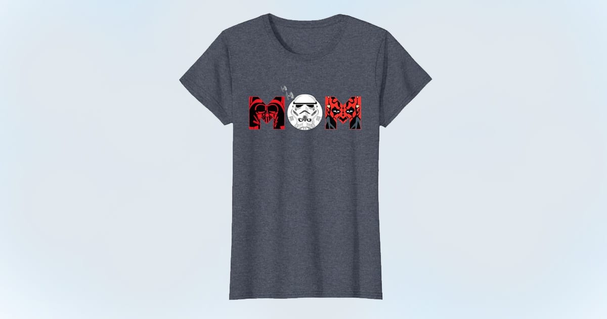 Heather blue T-shirt with the word “MOM” styled using Star Wars villains: Darth Vader, Stormtrooper, and Darth Maul, with TIE fighters above.