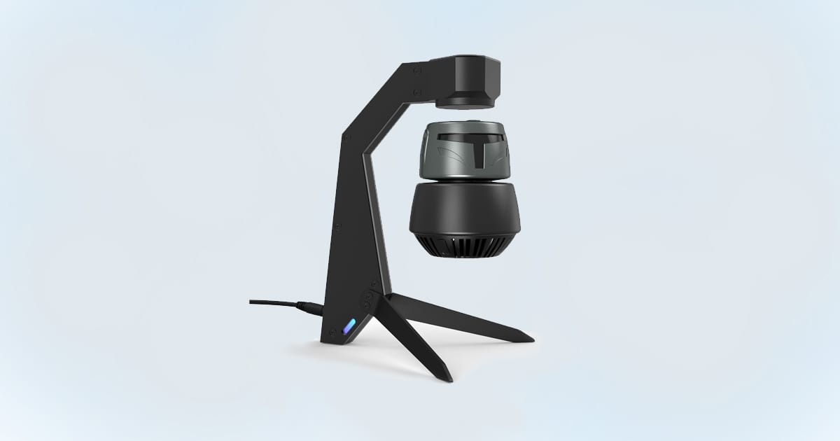 Levitating Mandalorian Bluetooth speaker suspended under a modern black stand, floating in mid-air with a futuristic design.