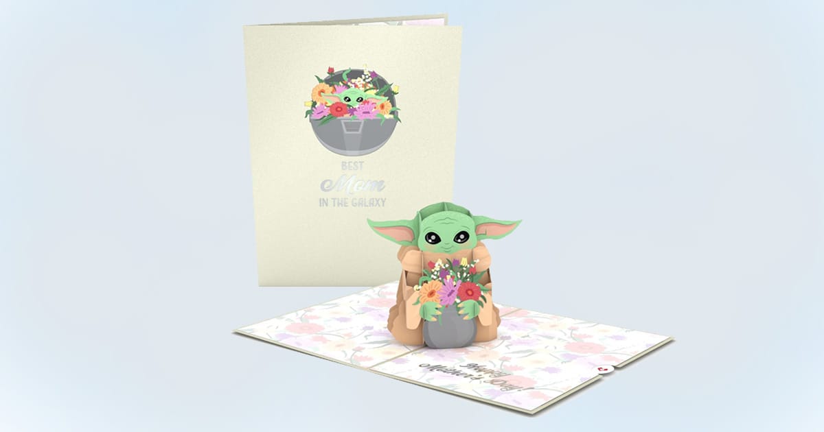 Grogu Mother’s Day pop-up card featuring Baby Yoda holding flowers with the text “Best Mom in the Galaxy” on a floral-themed base.