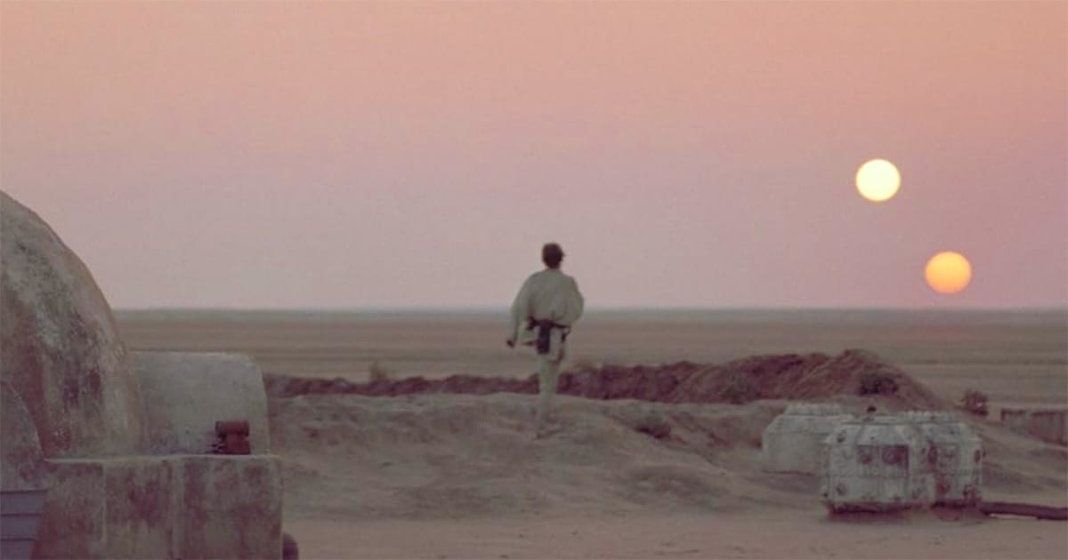 A screen capture from "Star Wars" showing the famous two moon scene.