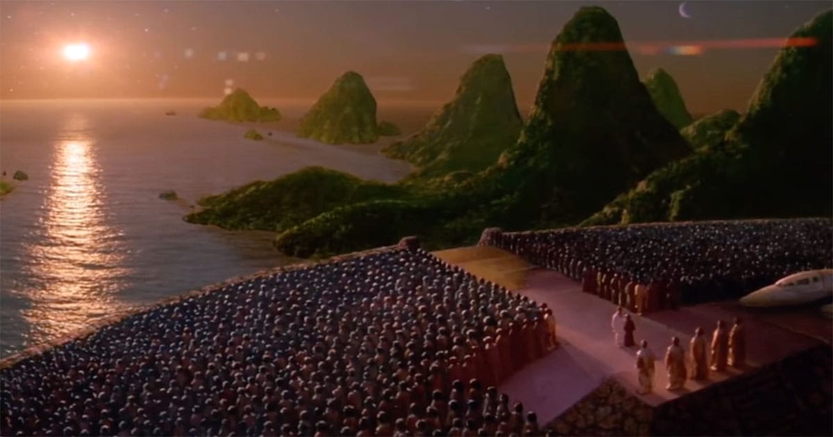 Davidge and Zammis standing before the Drac assembly on their homeworld in Enemy Mine (1985) symbolizing reconciliation between species and the inheritance of a shared future.