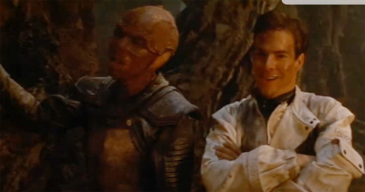 Davidge and Jeriba Shigan sharing a moment of friendship inside their shelter on Fyrine IV in Enemy Mine (1985).