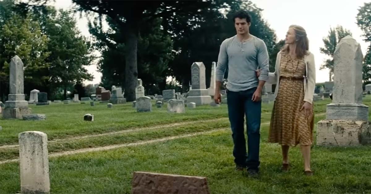 Clark Kent walks with Martha Kent through a cemetery, reflecting his connection to Earth and the moral identity forged through family and principle in "Man of Steel."
