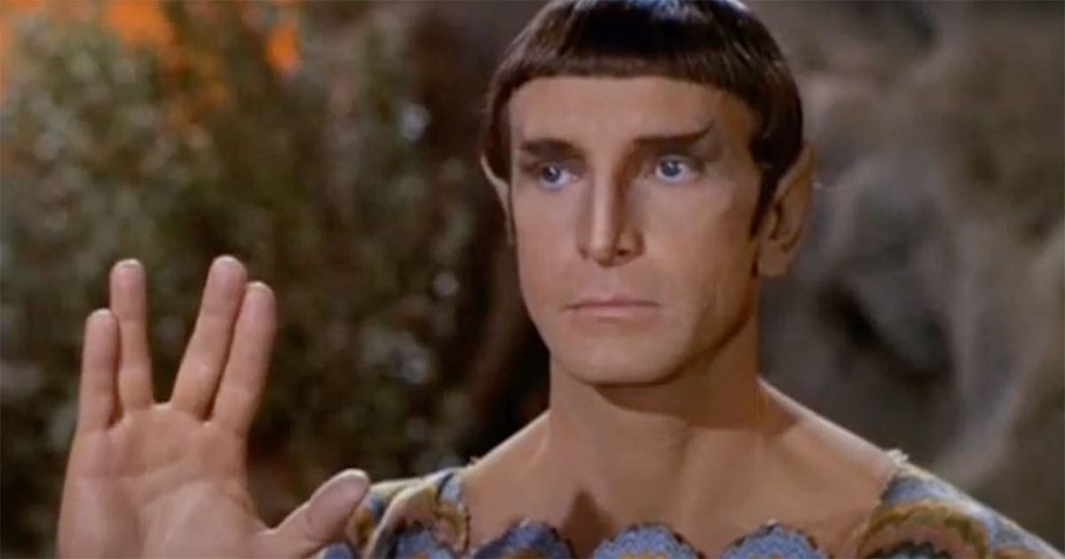 Vulcan elder holding up hand in salute during the "Star Trek" episode "Amok Time" (1967).