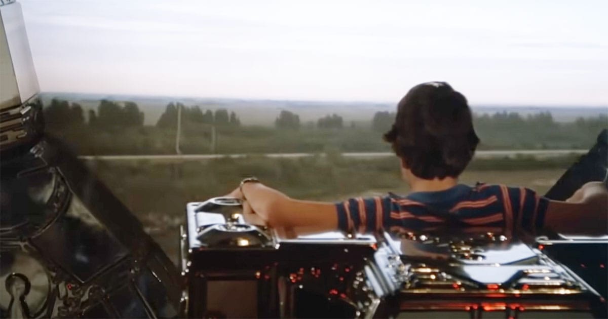 David Freeman pilots the spaceship and looks out at the landscape below in Flight of the Navigator.