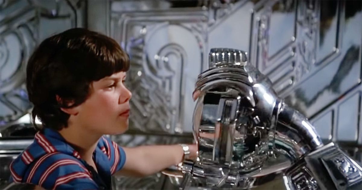 David Freeman stares at Max’s green robotic eye aboard the spaceship in Flight of the Navigator
