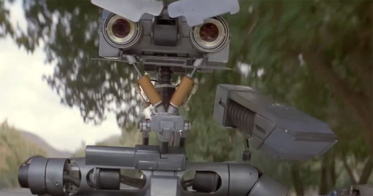 Johnny 5 from "Short Circuit" after blasting a tree to block pursuers during an escape.