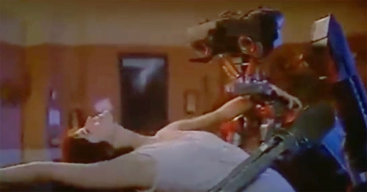 Johnny 5 and Stephanie from "Short Circuit" dancing together during their growing bond.
