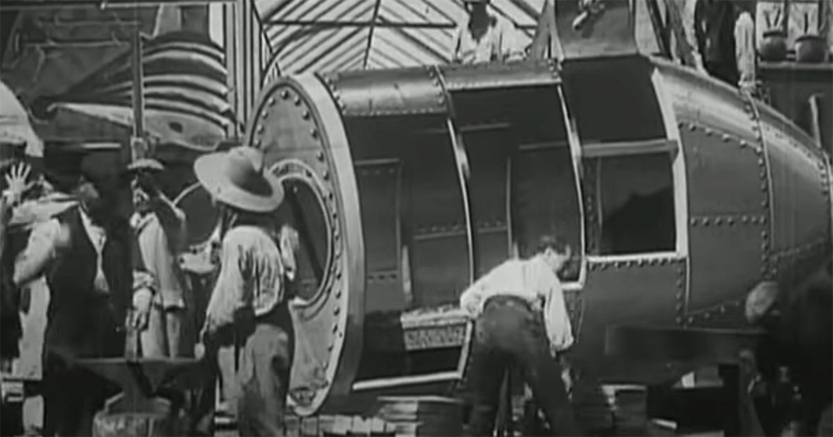 Scene from "A Trip to the Moon" showing characters constructing the Moon rocket.