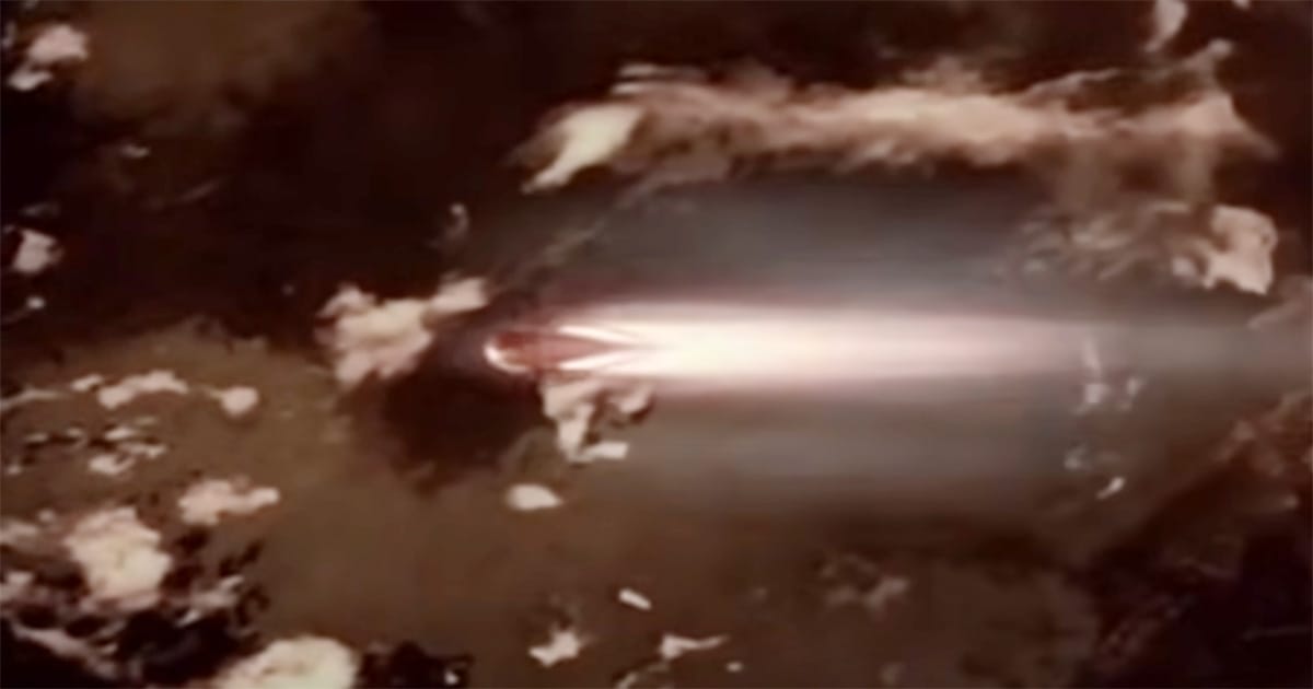 Scene from "Farscape" showing Moya escaping into space with a burst of light, symbolizing a narrow escape from Peacekeeper control.