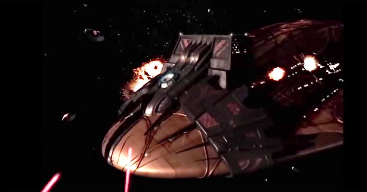 Scene from "Farscape" showing Moya under Peacekeeper attack with her control collar still attached.