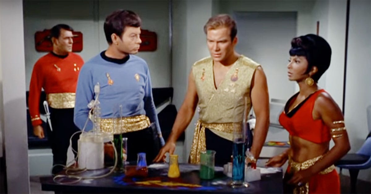 Captain Kirk, Uhura, Scotty, and McCoy in mirror universe uniforms in the sickbay scene from "Mirror, Mirror".