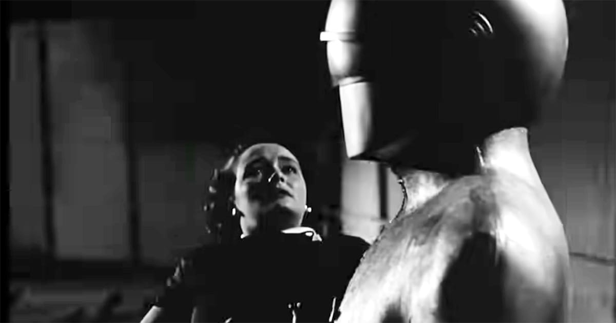 Helen Benson looks up fearfully at Gort the robot in a tense moment from The Day the Earth Stood Still (1951).
