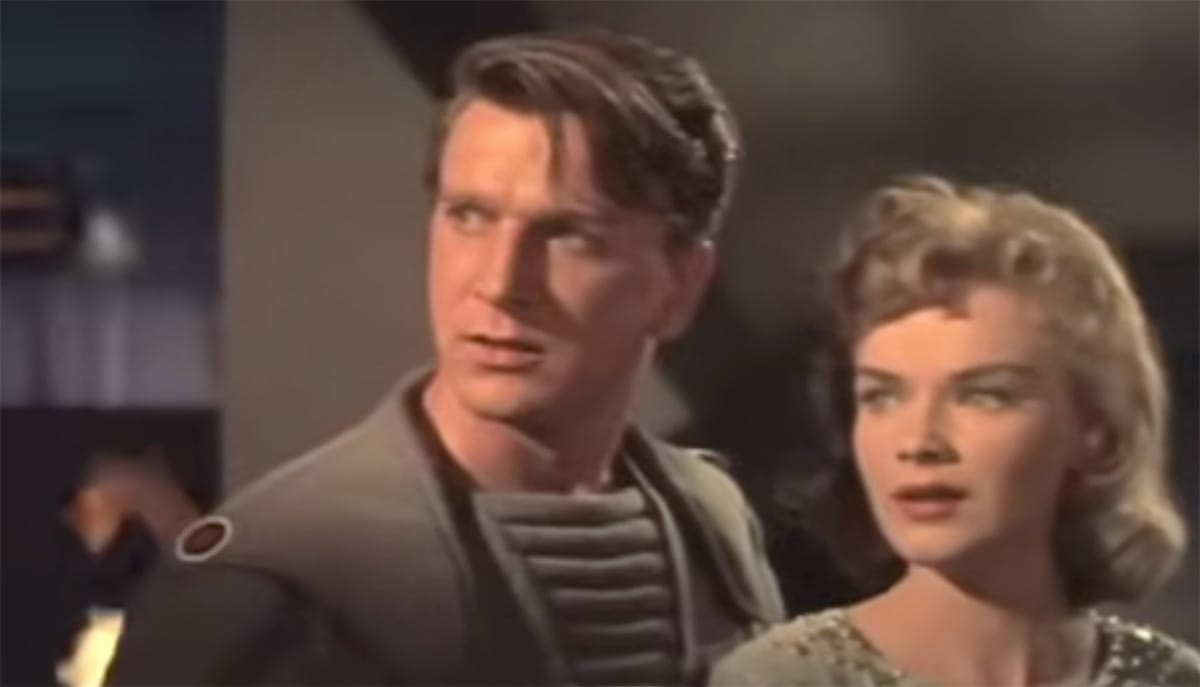 Commander John J. Adams and Altaira Morbius in the 1956 film "Forbidden Planet," reflecting the film’s blend of human drama and science fiction adventure.