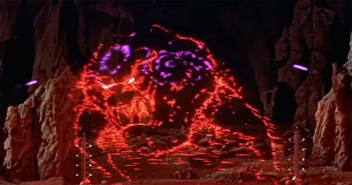The monster from the id attacking in the 1956 film "Forbidden Planet," symbolizing the destructive potential of unchecked ambition and subconscious fear.