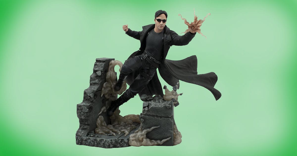 Neo Deluxe PVC Statue from The Matrix, 10-inch collectible diorama showing Neo in black trench coat mid-action with ruined stone backdrop.