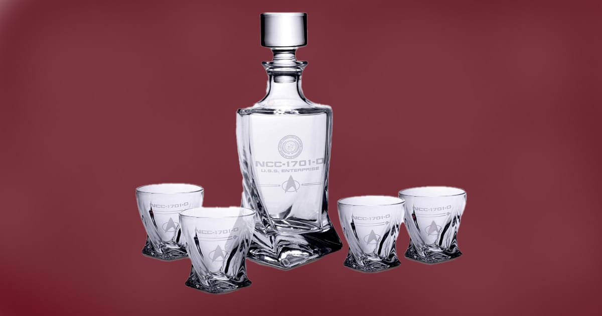 Star Trek The Next Generation whiskey decanter set with four etched glasses featuring NCC-1701-D and Starfleet insignia.