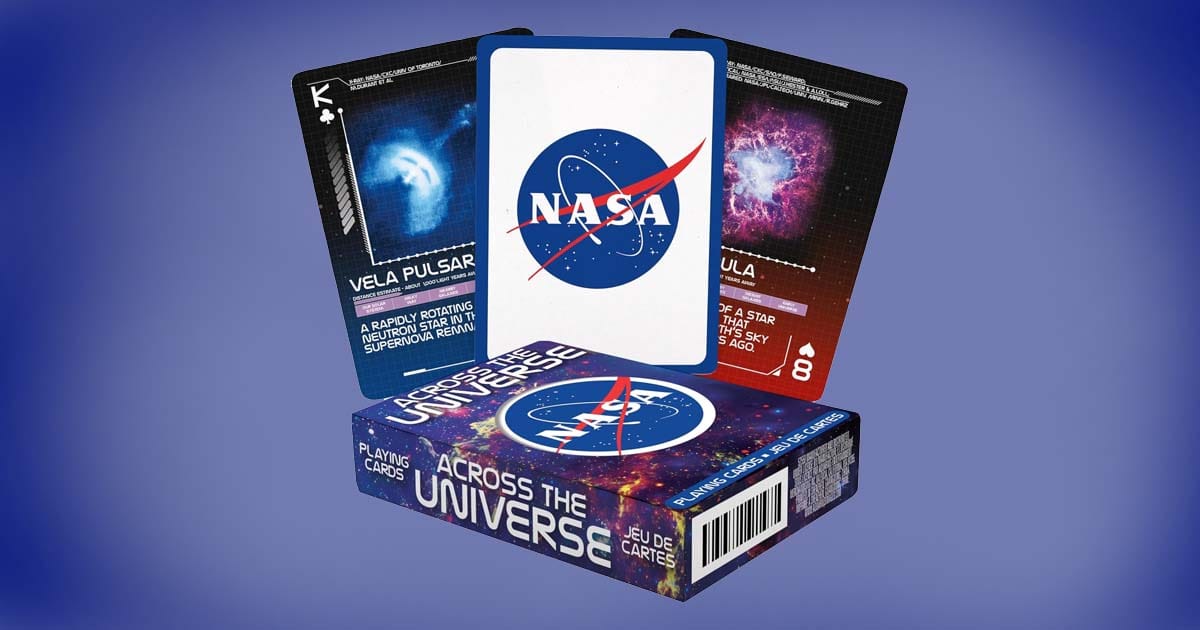 NASA-themed playing cards displayed with box, showing designs of the Vela Pulsar and Crab Nebula alongside the NASA logo.