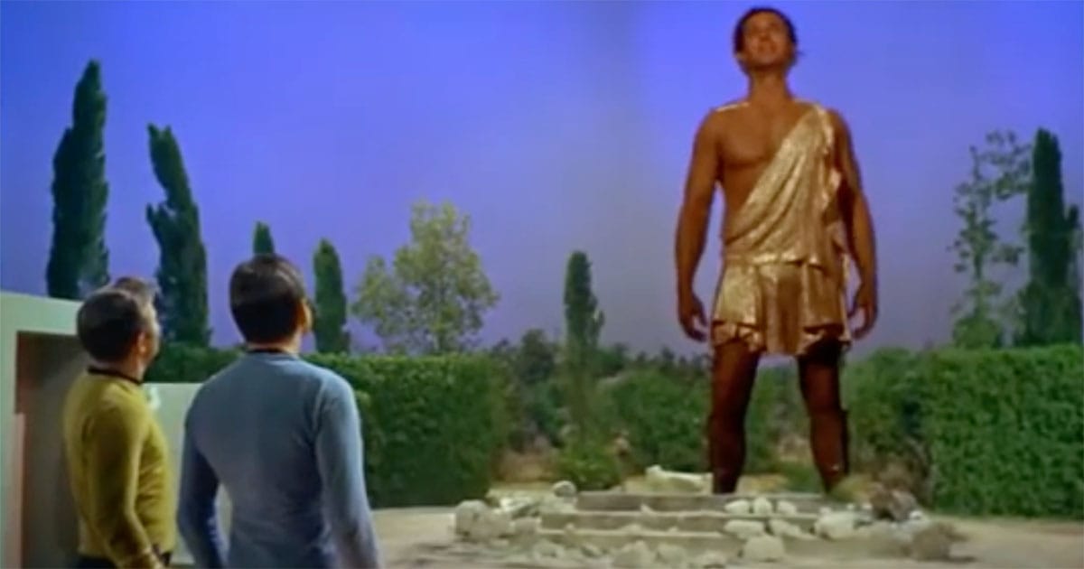 Captain Kirk and crew face the towering figure of Apollo in "Star Trek: The Original Series" episode "Who Mourns for Adonais?" depicting a powerful alien mistaken for a god.