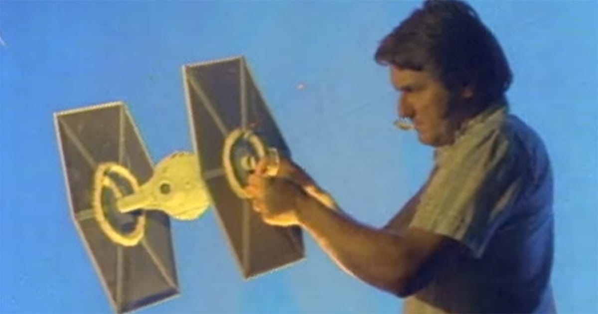 TIE Fighter studio model adjusted by technician for "Star Wars" filming