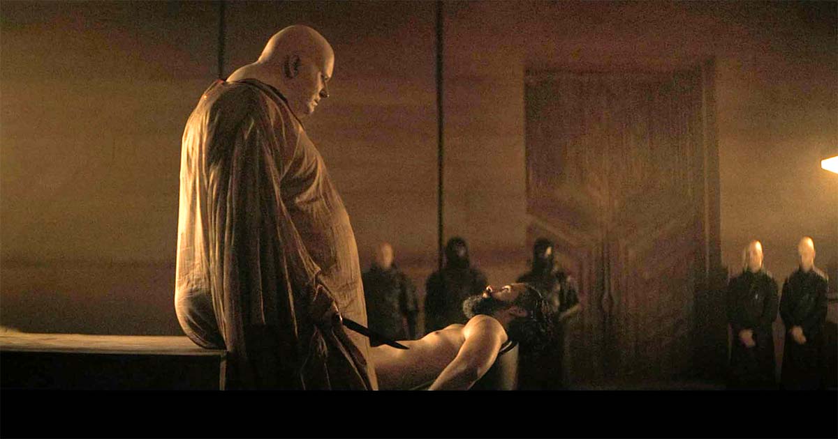 A screen capture from Dune Part One featuring Stellan Skarsgård as the Baron and Oscar Isaac as the Duke.