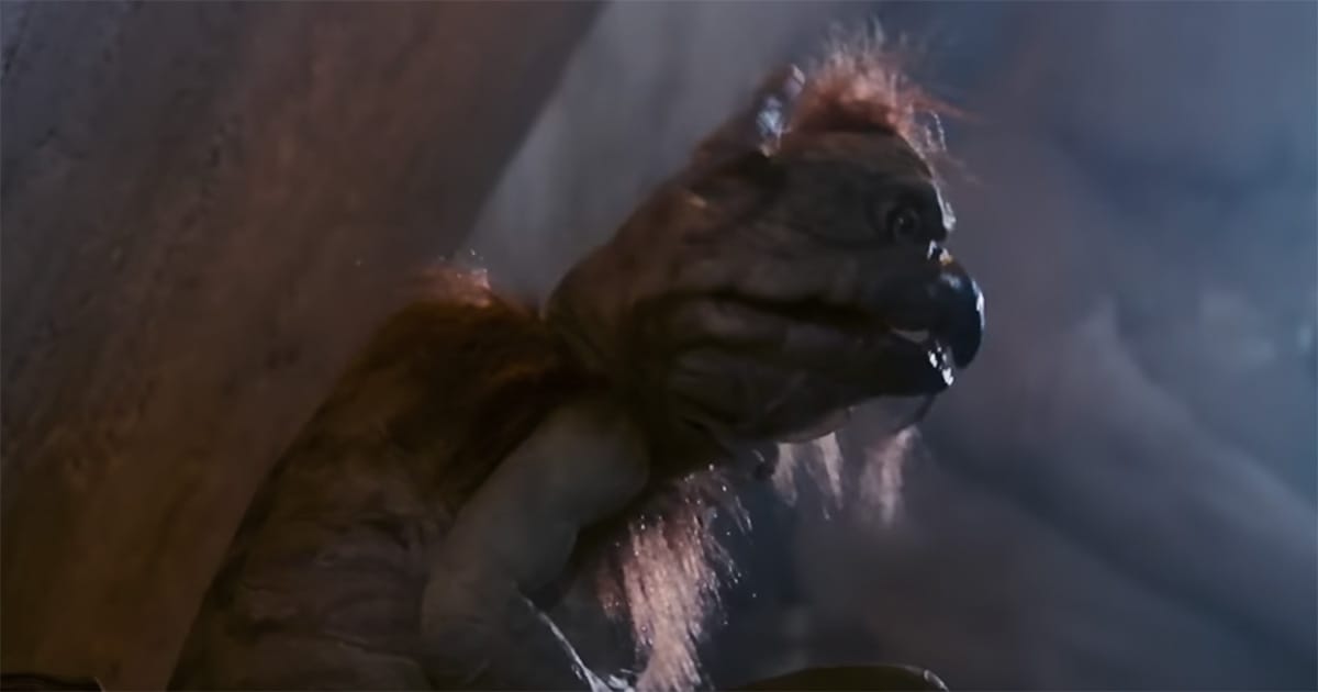 Star Wars image of Salacious B. Crumb, a small creature with a beak and scruffy hair, laughing in Jabba’s palace as one of the trilogy’s most mischievous background characters.