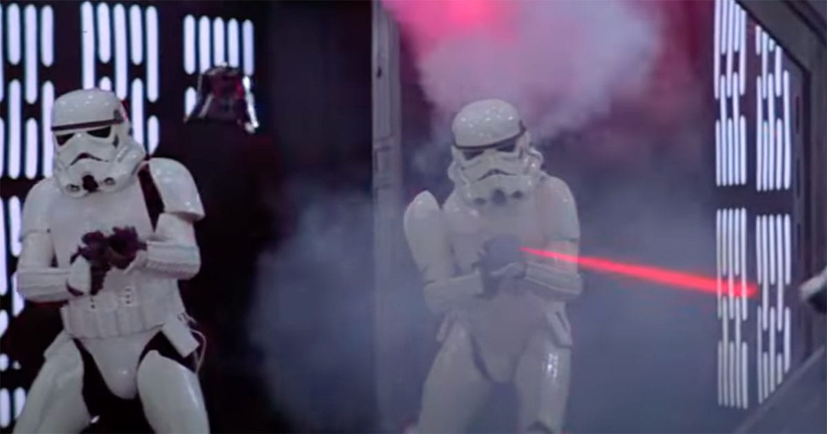 Stormtroopers firing blasters in a smoky corridor showing the cinematic style and dramatic focus of battle scenes in “Star Wars.”