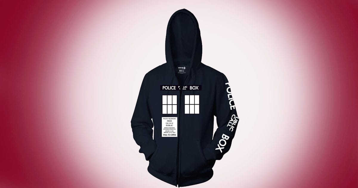 Doctor Who navy blue zip-up hoodie featuring TARDIS police box design on front and sleeve on red background.