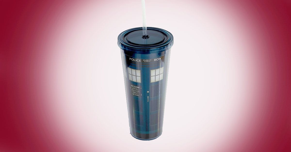 Doctor Who TARDIS acrylic travel tumbler with lid and straw on red background.