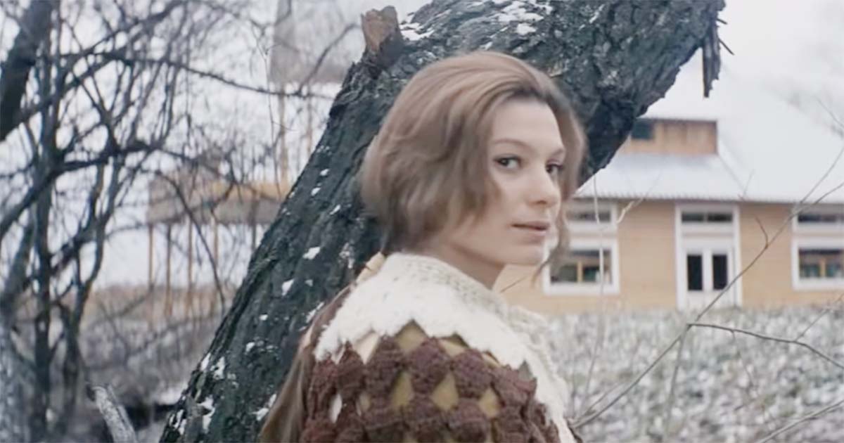 Hari, recreated from Kris Kelvin’s memories, stands beside a tree outside their country home in Andrei Tarkovsky’s 1972 film "Solaris."