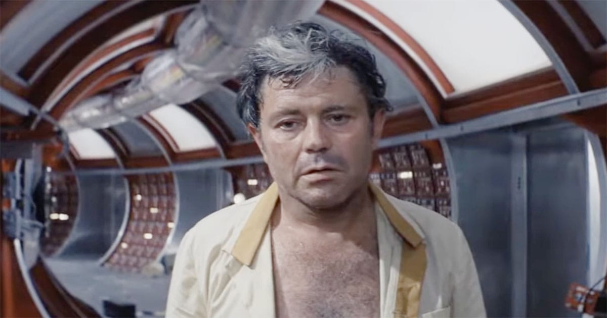Close-up of Kris Kelvin inside the Solaris space station, his expression weary and haunted in Andrei Tarkovsky’s 1972 film.