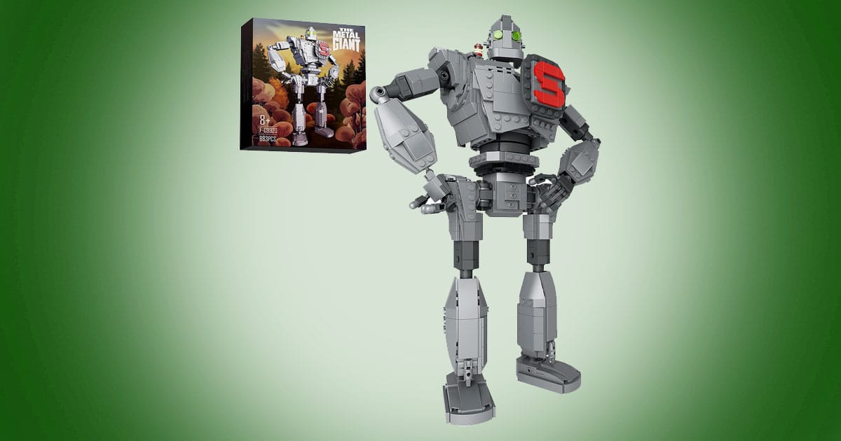 Lego-compatible iron robot building set with red chest emblem and packaging displayed on green background.