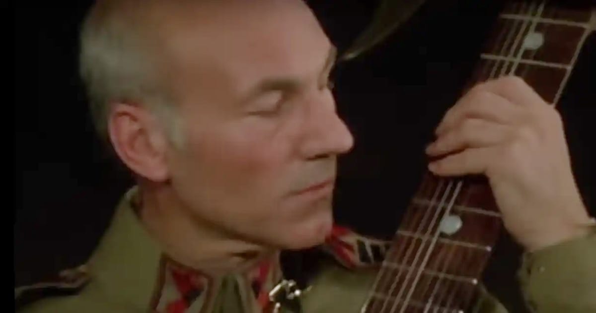 Patrick Stewart as Gurney Halleck playing the baliset in the 1984 Dune film directed by David Lynch.