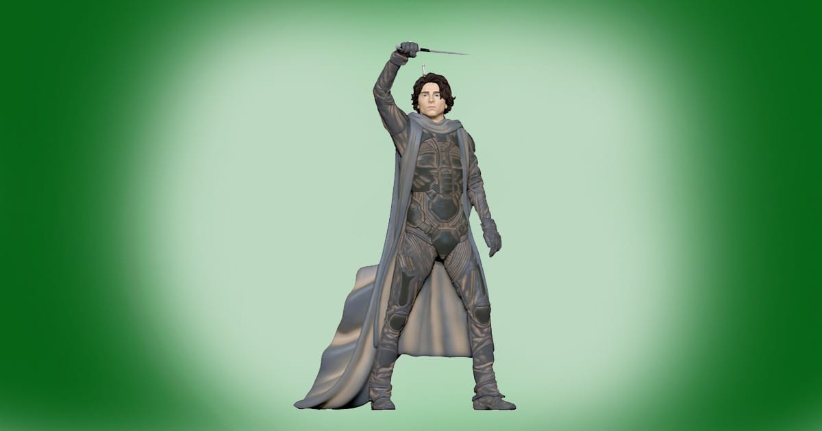 Hallmark Keepsake ornament of Paul Atreides from Dune 2024 featuring the character in a stillsuit holding a crysknife, designed for hanging on a Christmas tree.