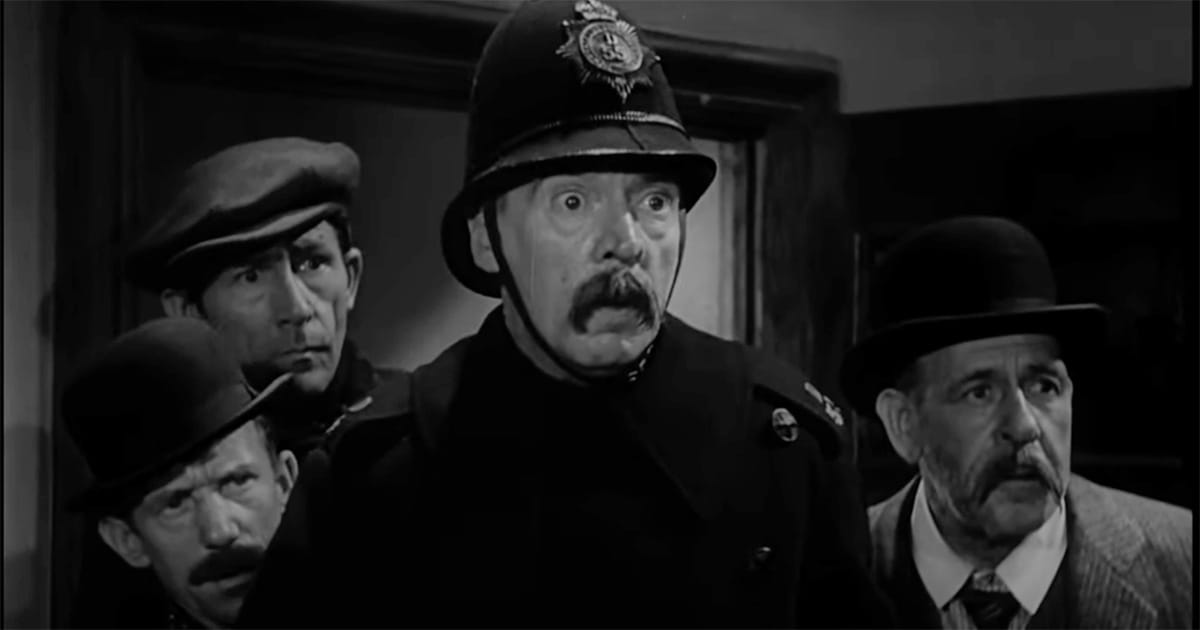 A group of men, including a policeman, react in shock to an unseen presence, reflecting the limits of understanding.