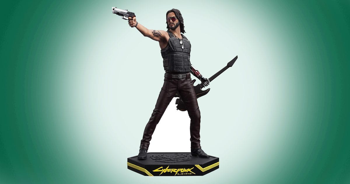 Johnny Silverhand Cyberpunk 2077 figure with pistol and guitar on display stand.