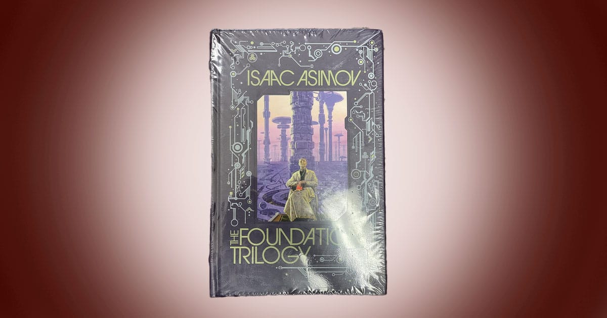 Cover of The Foundation Trilogy by Isaac Asimov classic science fiction novel collection featuring futuristic city and seated figure.