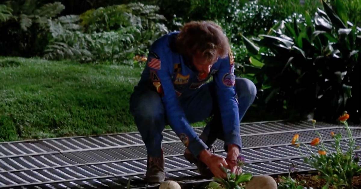 Freeman Lowell kneels inside the forest dome tending plants aboard the spacecraft in Silent Running from 1972.