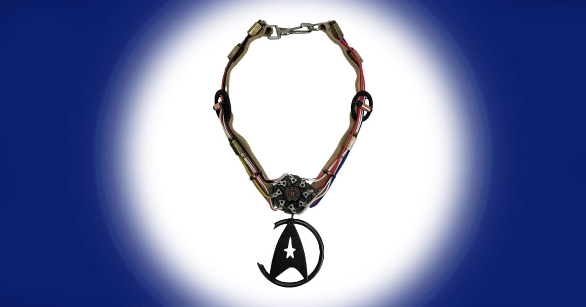 Limited edition prop replica of Khan’s necklace from Star Trek II The Wrath of Khan featuring metallic details and Starfleet style emblem.