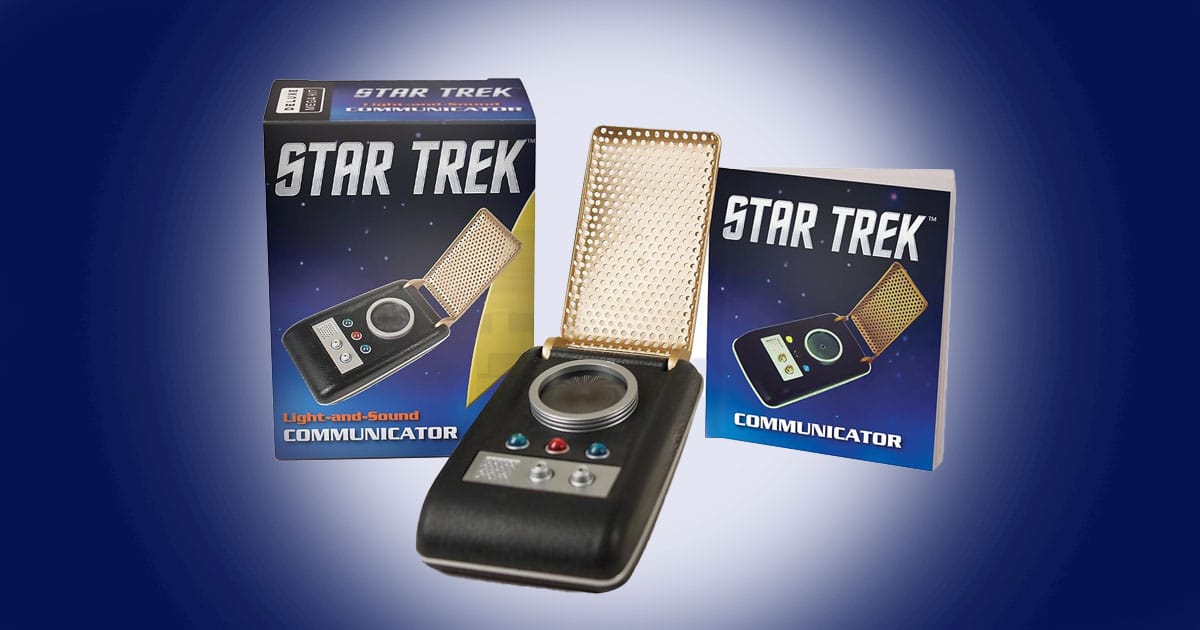 Star Trek light and sound communicator replica with flip open design shown with packaging and companion booklet on a blue background.