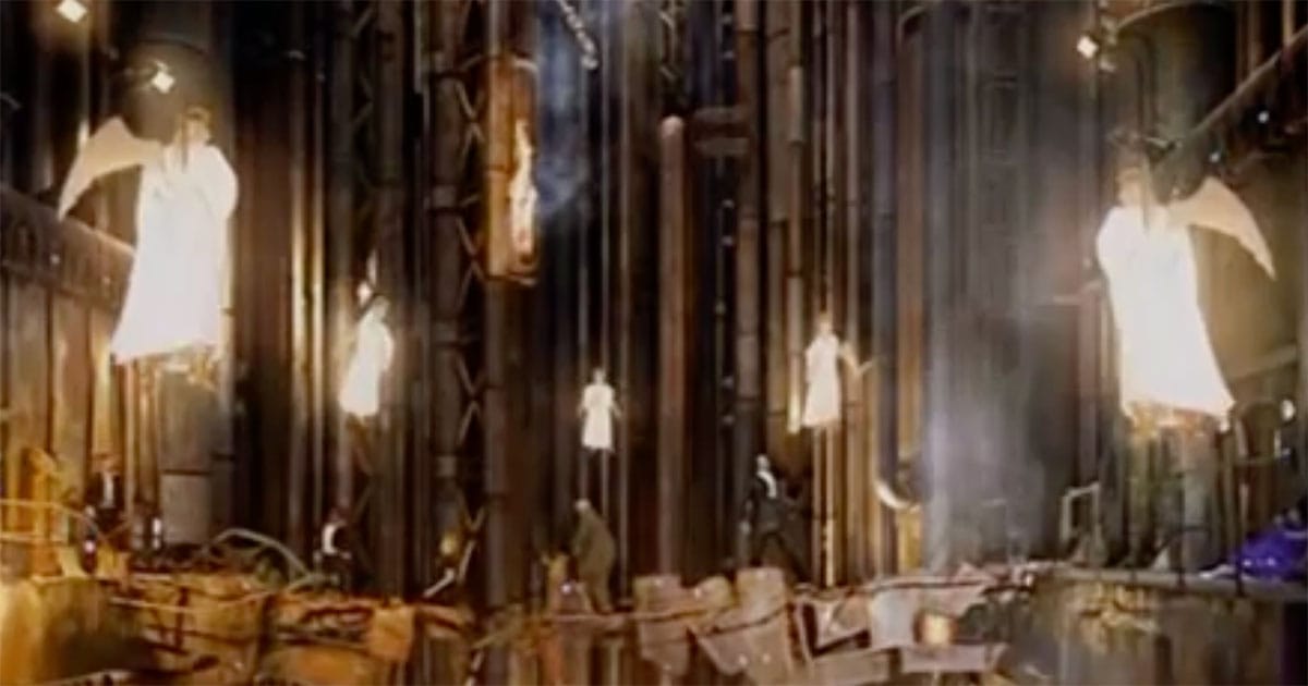 Angelic figures appearing inside an industrial setting during a Doctor Who Christmas episode.