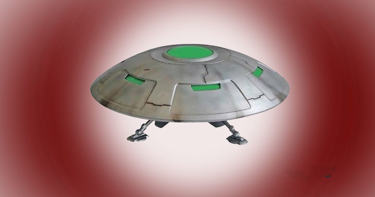 Area 51 UFO science fiction model kit shown assembled as a classic flying saucer with landing gear and green accent panels.