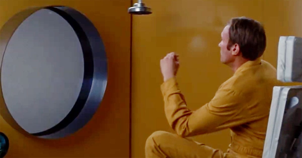 Scientists in protective suits conduct a biological investigation inside a quarantined home in the film "The Andromeda Strain" (1971).